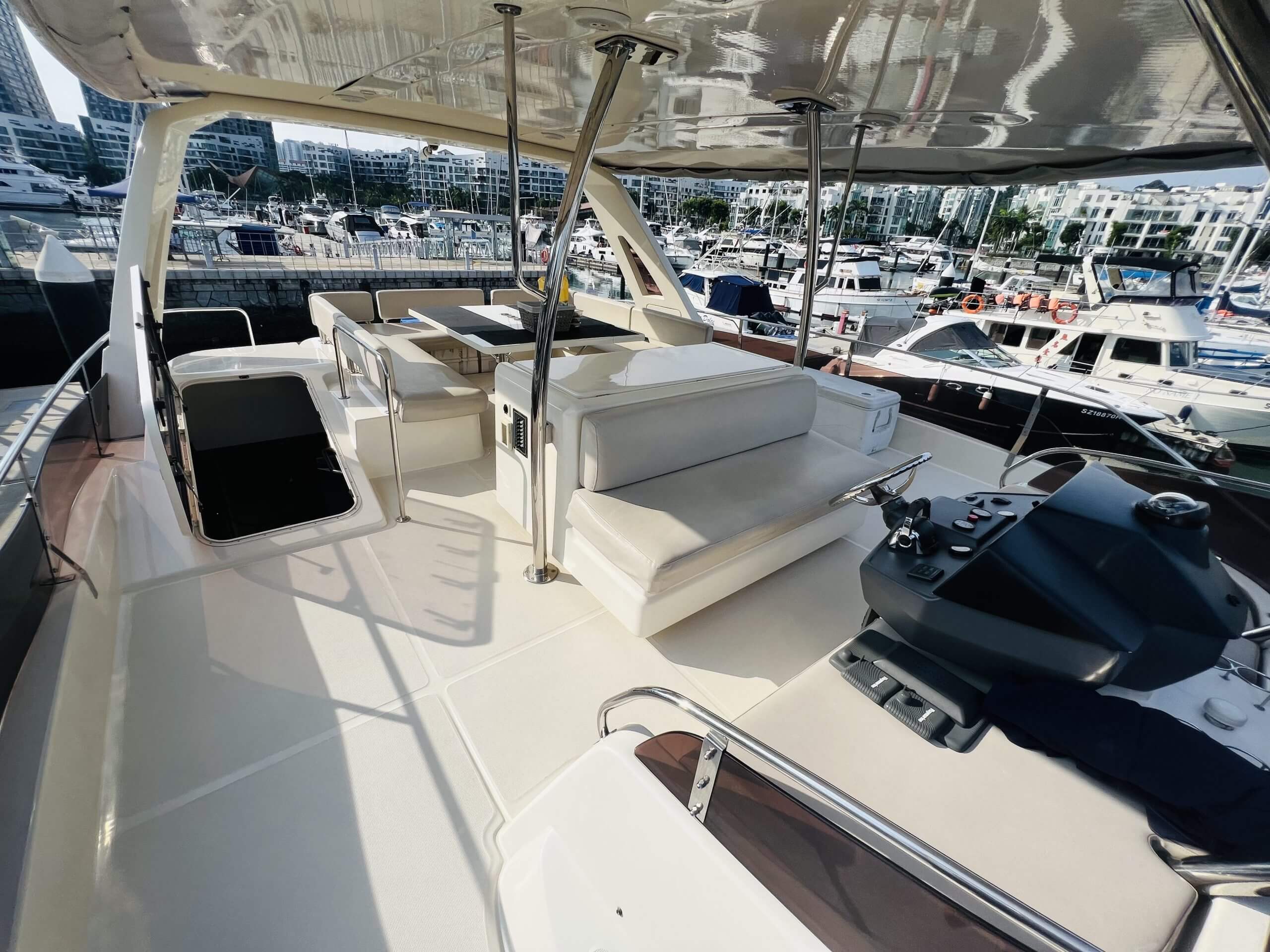 The 2018 Aquila 48 Power Catamaran – Flybridge seating with jet ski on the aft deck – Avelis Yachts Singapore
