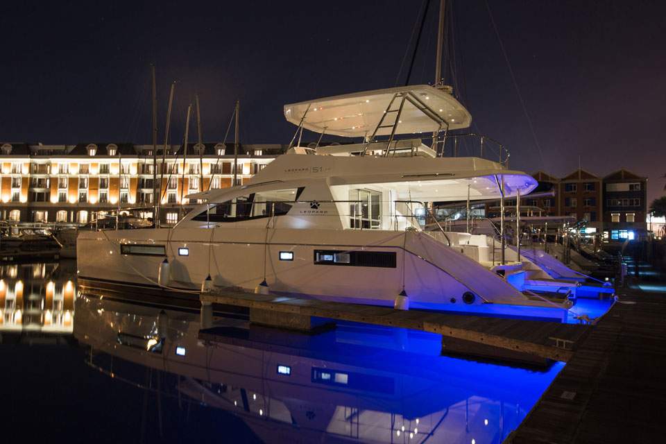 The Leopard 51 Luxury Power Catamaran – Berthed at night with underwater lighting – Avelis Yachts Singapore