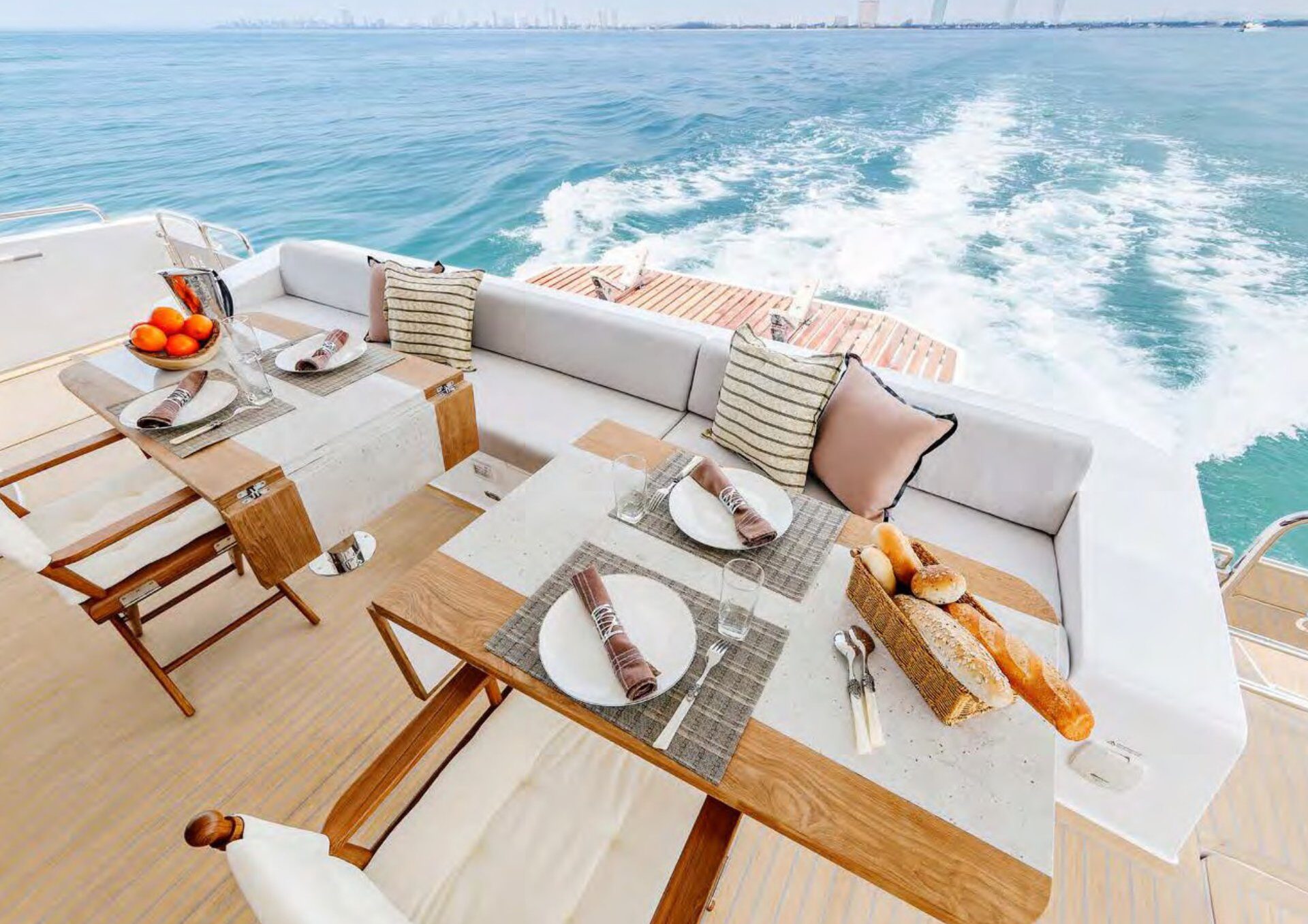 The 2024 Cora 48 Power Catamaran – Aft deck table set for lunch underway – Avelis Yachts Singapore