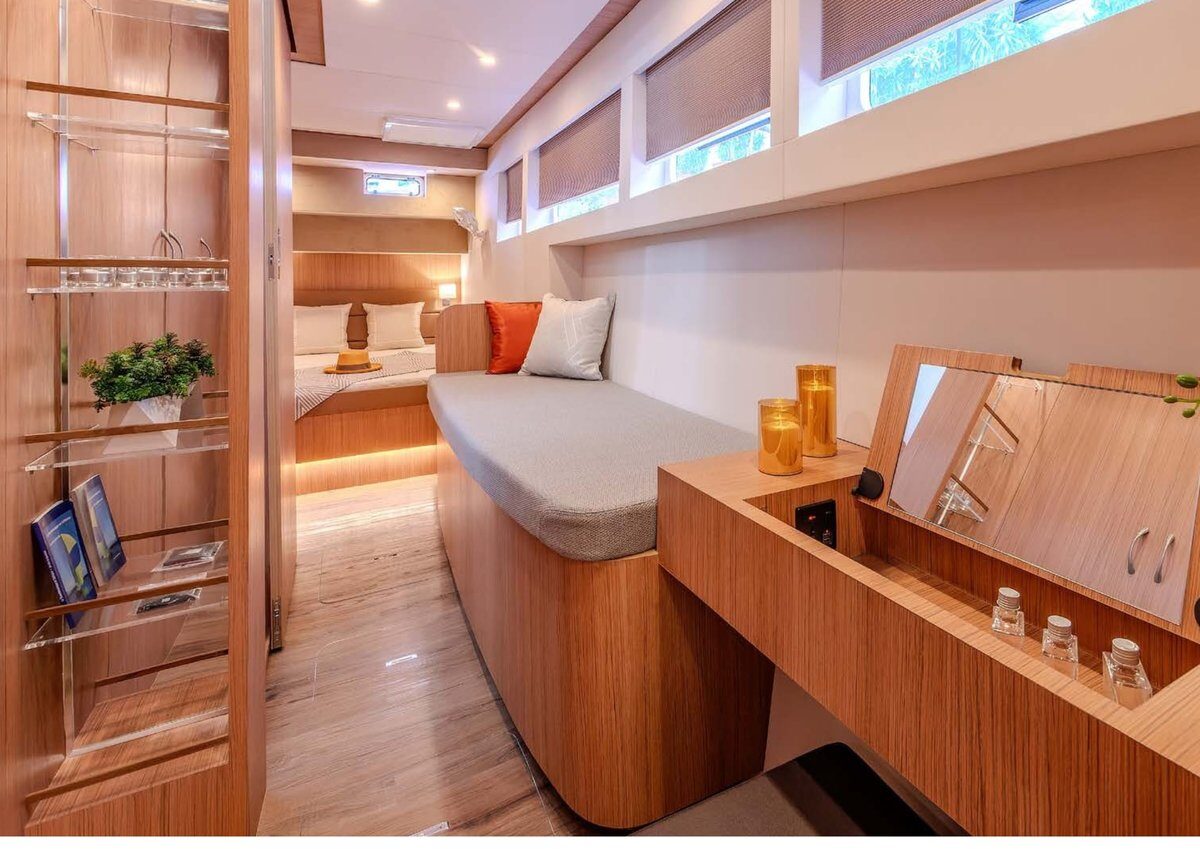 The 2024 Cora 48 Power Catamaran – Guest cabin passage with dressing table – Avelis Yachts Singapore