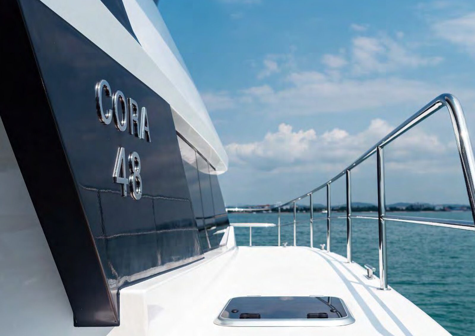 The 2024 Cora 48 Power Catamaran – Hull name detail on the topsides underway – Avelis Yachts Singapore