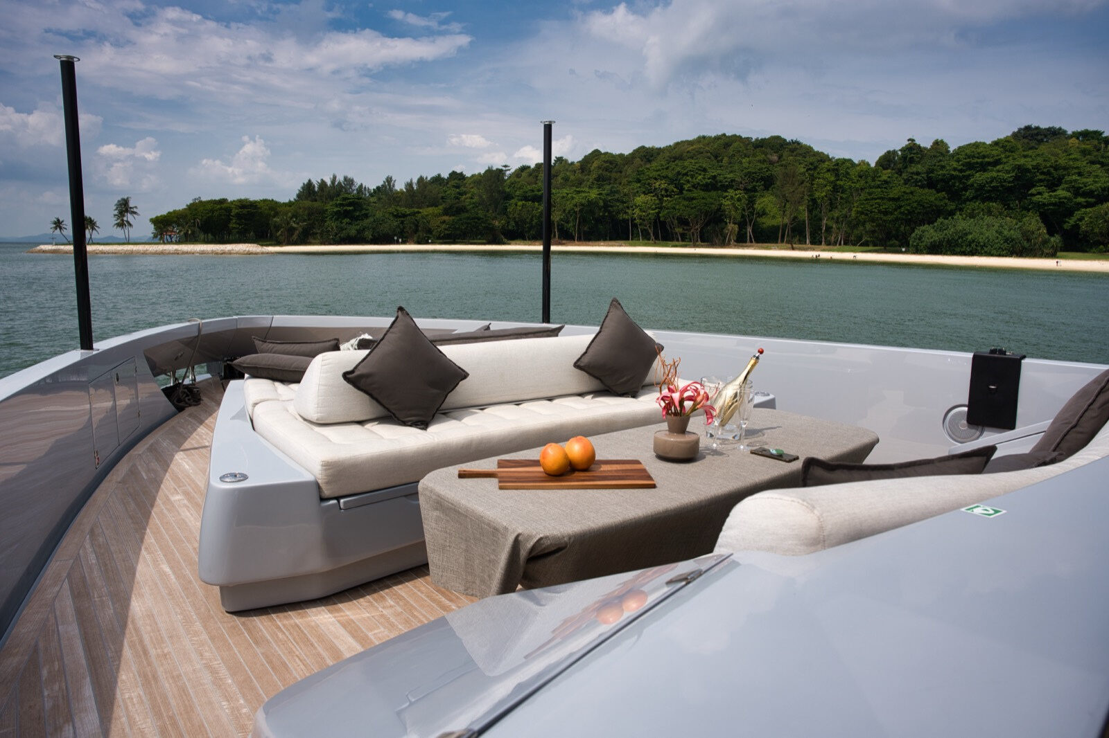 The Manda 72 Luxury Motor Yacht – Aft deck lounge at anchor off an island – Avelis Yachts Singapore