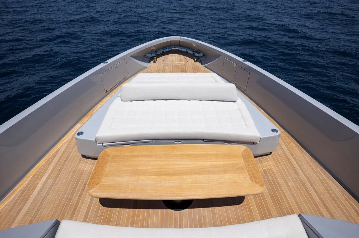 The Manda 72 Luxury Motor Yacht – Foredeck sun mattresses and teak table – Avelis Yachts Singapore