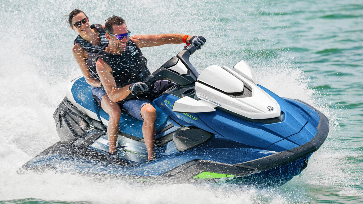The Manda 72 Luxury Motor Yacht – Guests riding a jet ski alongside – Avelis Yachts Singapore